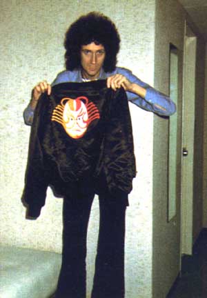 Brian holding up a jacket xD